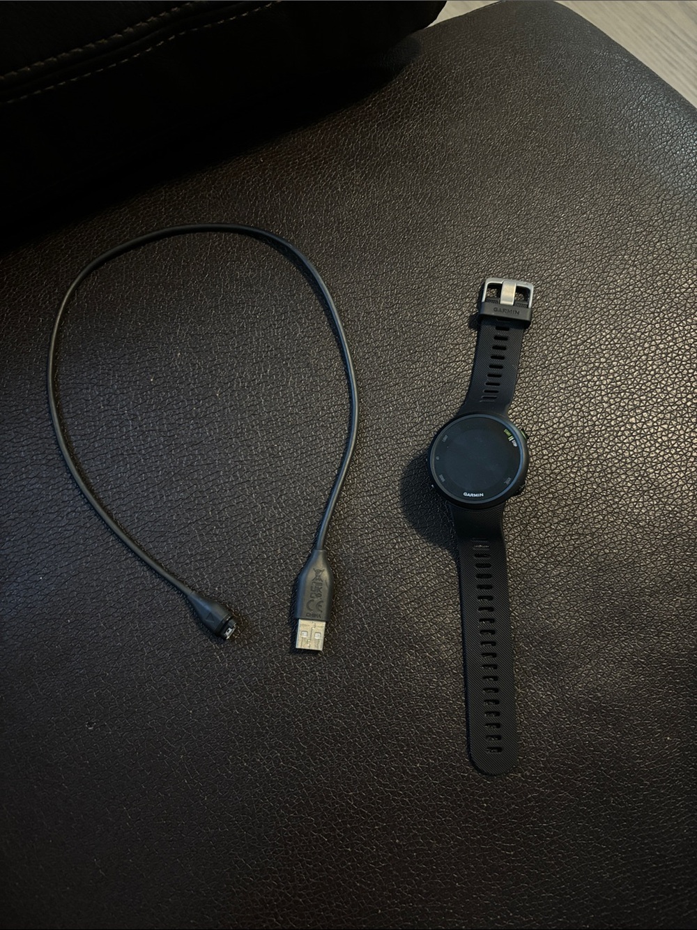 garmin black GPS forerunner 45 fitness watch with charging cable